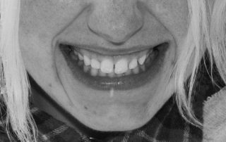 Black and white photo of girl smiling