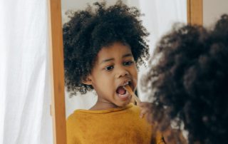 Kid brushing teeth