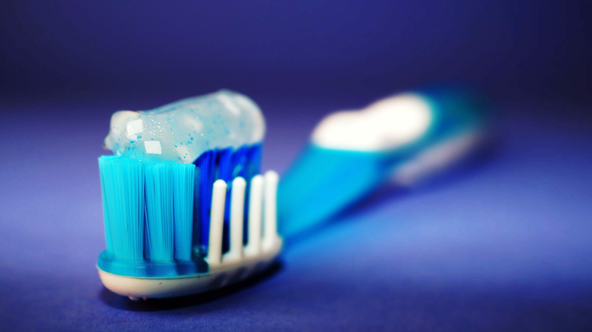 Closeup of toothbrush with toothpaste