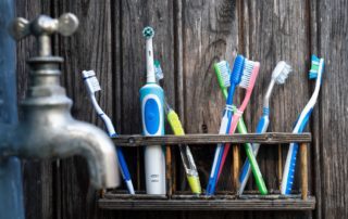 assortment of toothbrushes on a shelf
