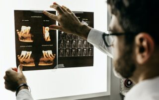 dentist looking at patient xrays
