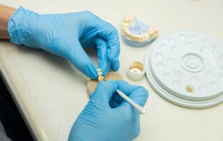 Dentist cleaning dentures
