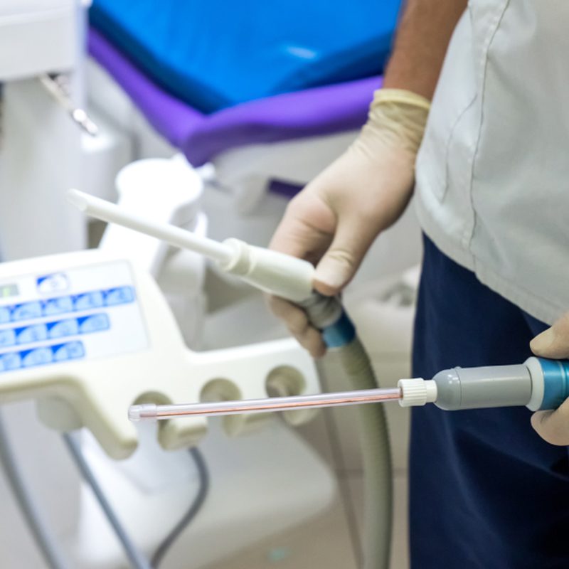 dental tech operating water machine