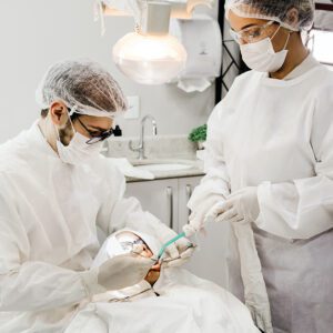 dentist and tech working on patient