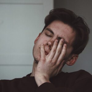 man suffering from a headache