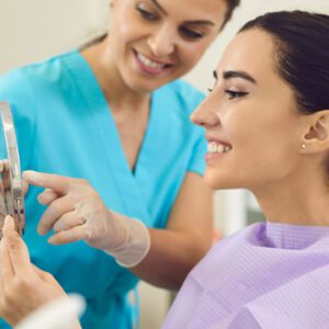 Dentist and patient in happy mood