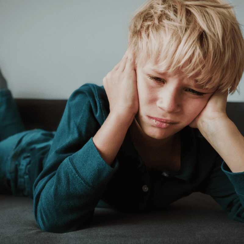 _kid suffering from sore jaw muscles and sensitive teeth kid suffering from sore jaw muscles and sensitive teeth
