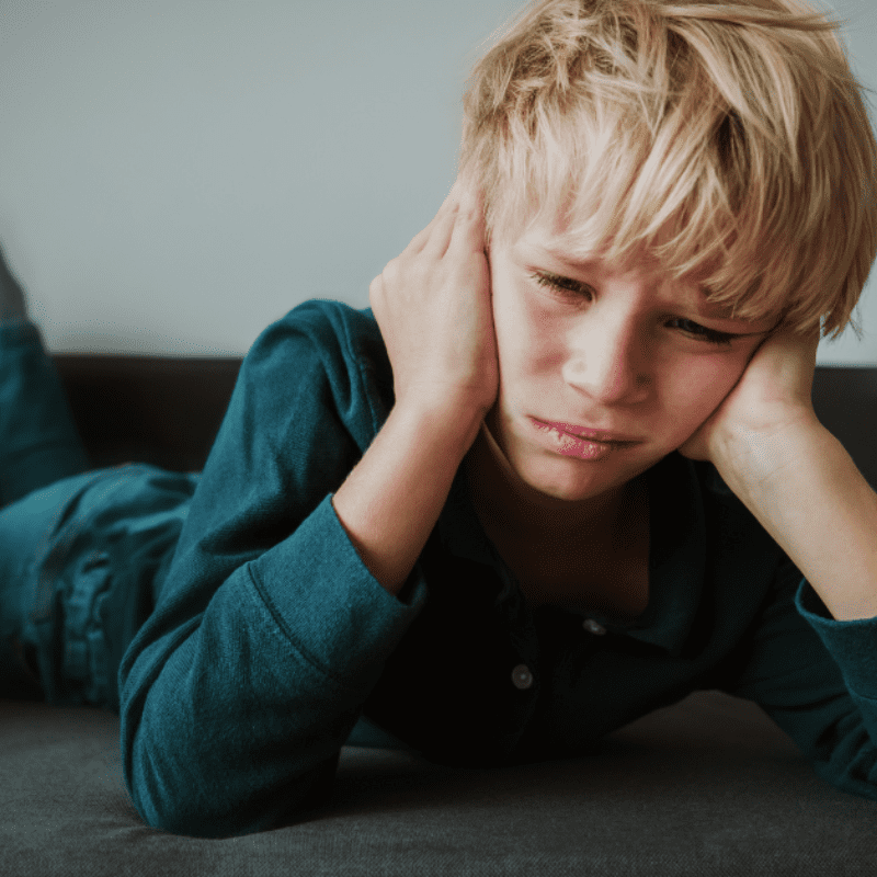 _kid suffering from sore jaw muscles and sensitive teeth kid suffering from sore jaw muscles and sensitive teeth