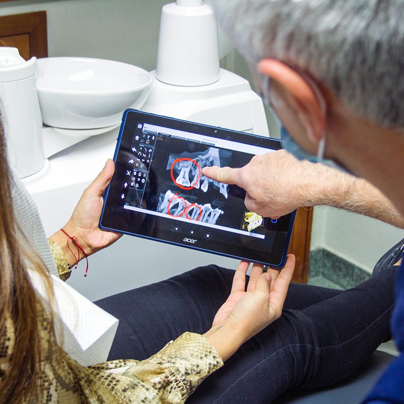 dentist reviewing xray dentist reviewing xray