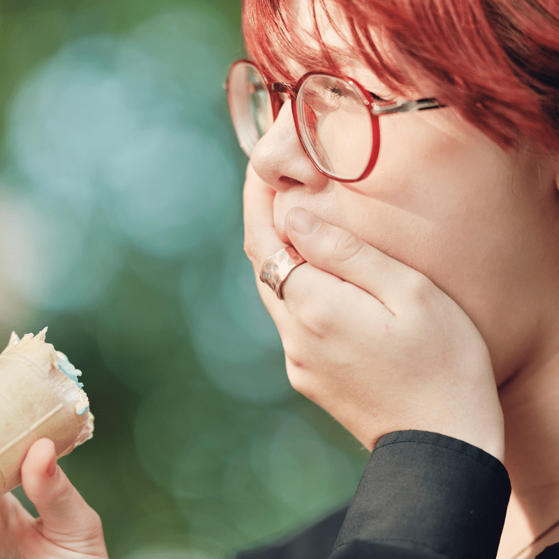 girl experiencing tooth sensitivity while eating ice cream tooth sensitivity, ice cream