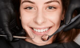 happy patient at professional teeth whitening dental clinic
