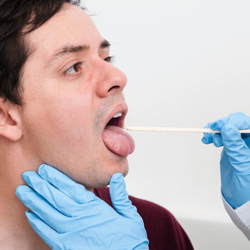 oral health examination with tongue depressor oral health examination with tongue depressor