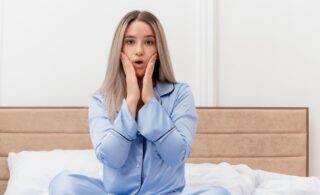 woman suffering extreme tooth pain and cant sleep