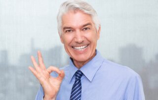 old man with permanent dentures