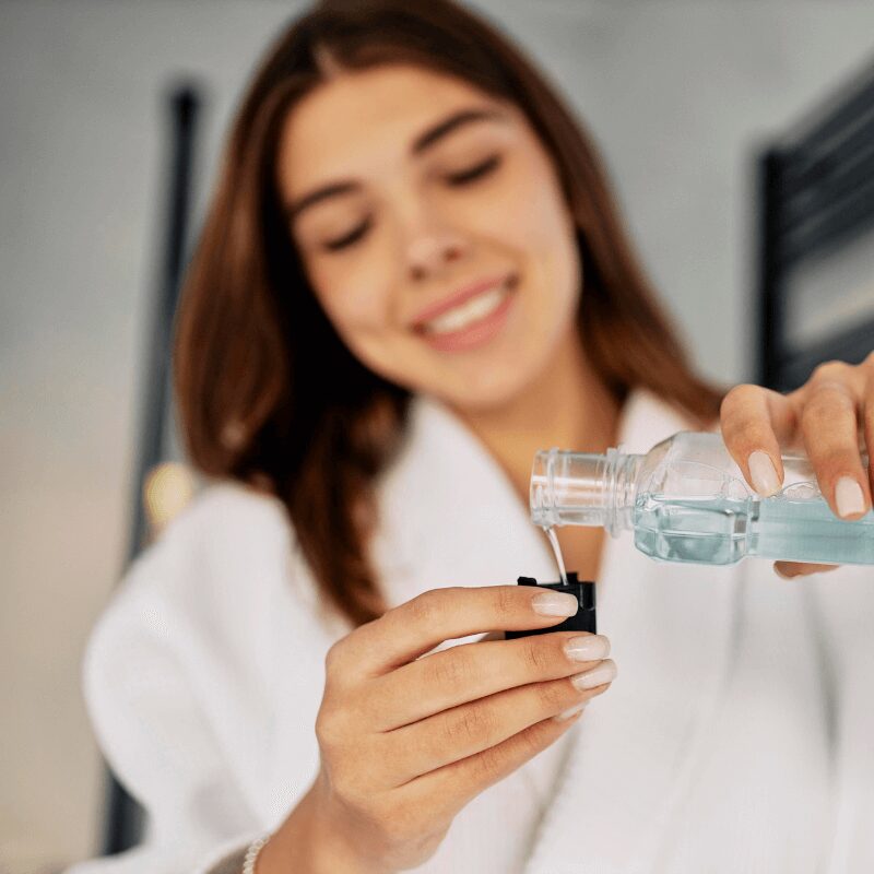 woman-pouring-mouth-wash woman-pouring-mouth-wash