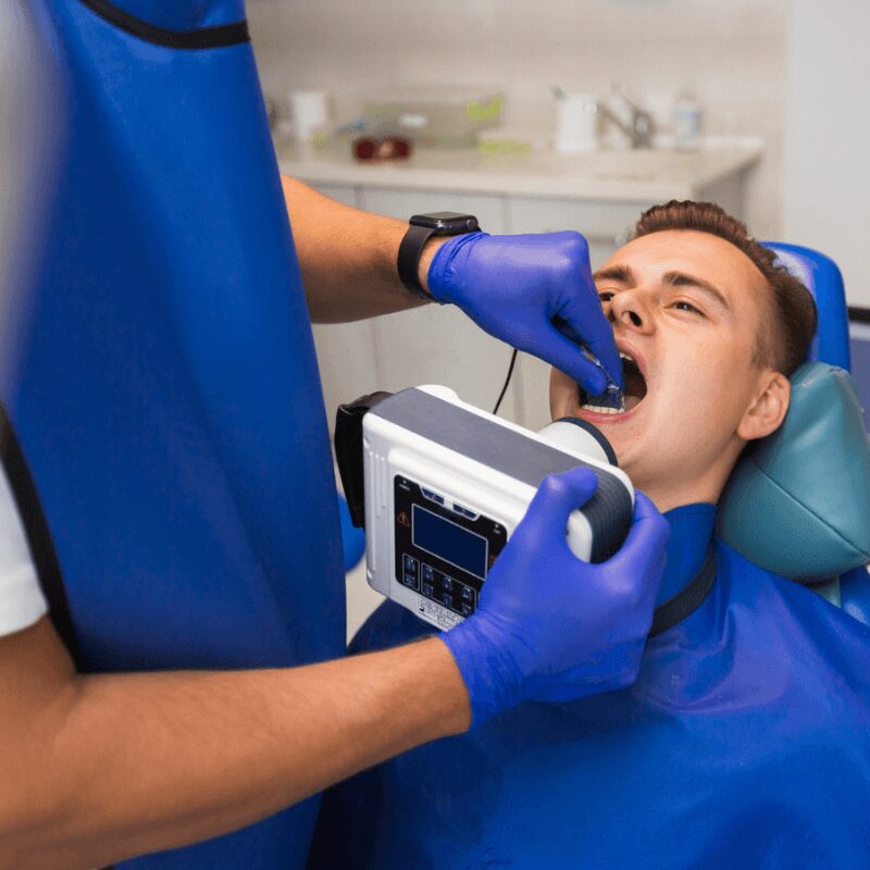 professional dentist examining patient teeth professional dentist examining patient teeth