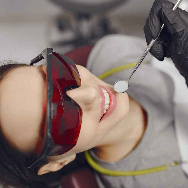 smiling girl getting dental checkup smiling girl getting dental checkup