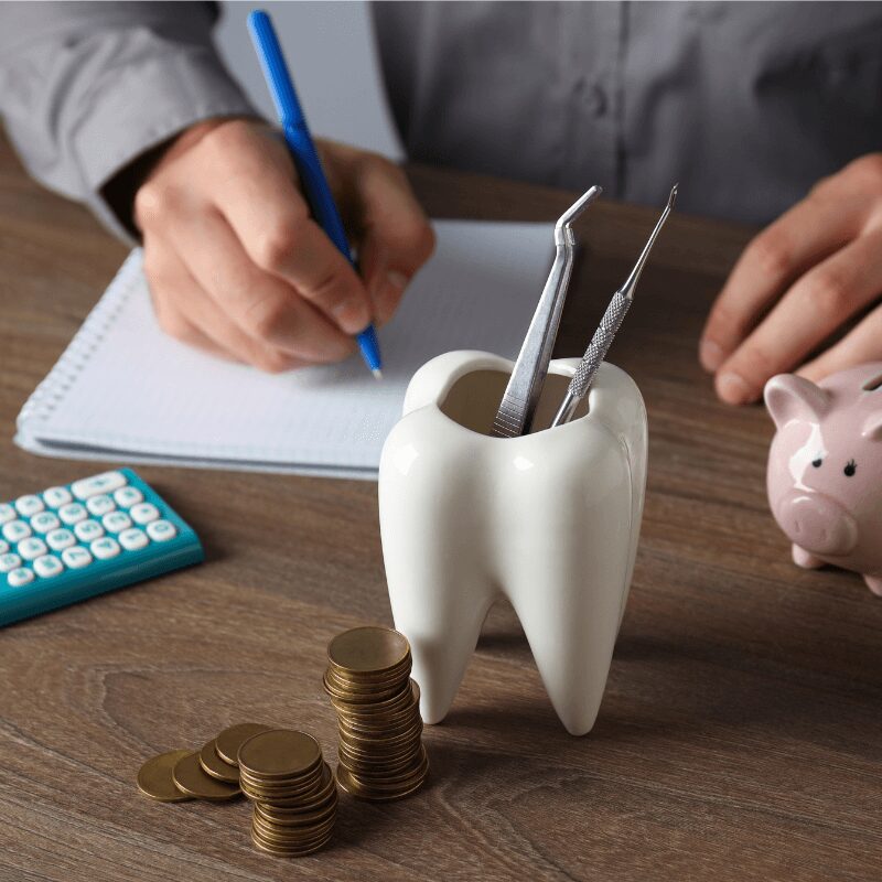 dentist calculating full mouth dental implants cost