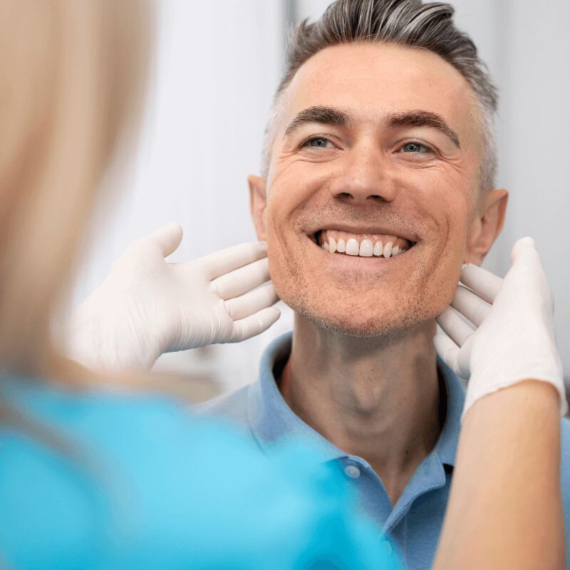 male patient after installing full mouth dental implants, upper arch