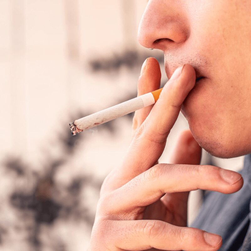 young man smoking a cigarette