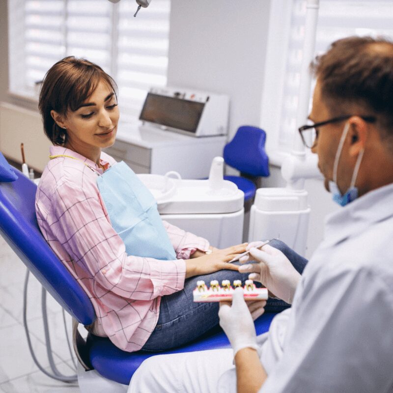 young girl having consultation with dentist in dentist office