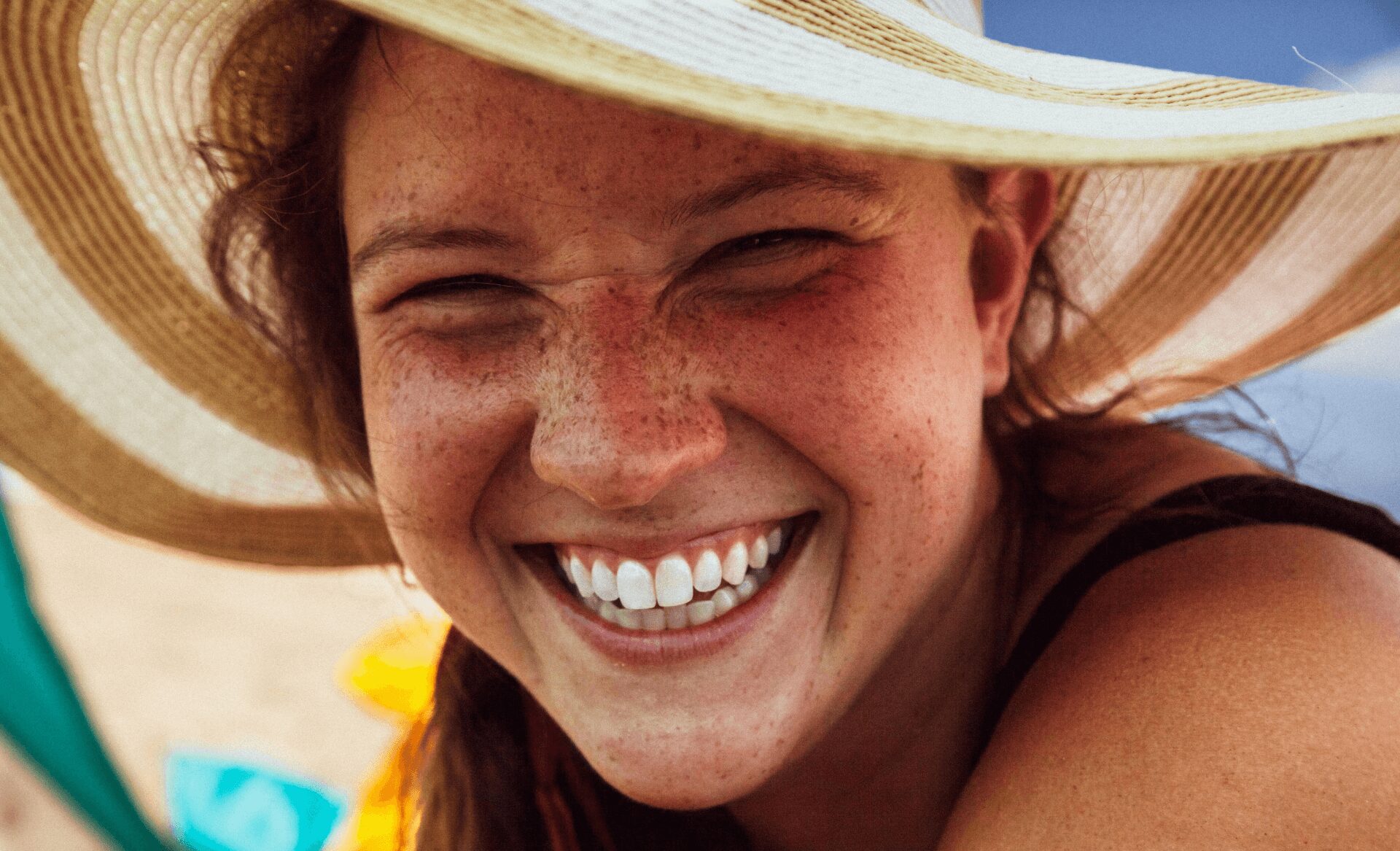 girl smiling with white spots on teeth