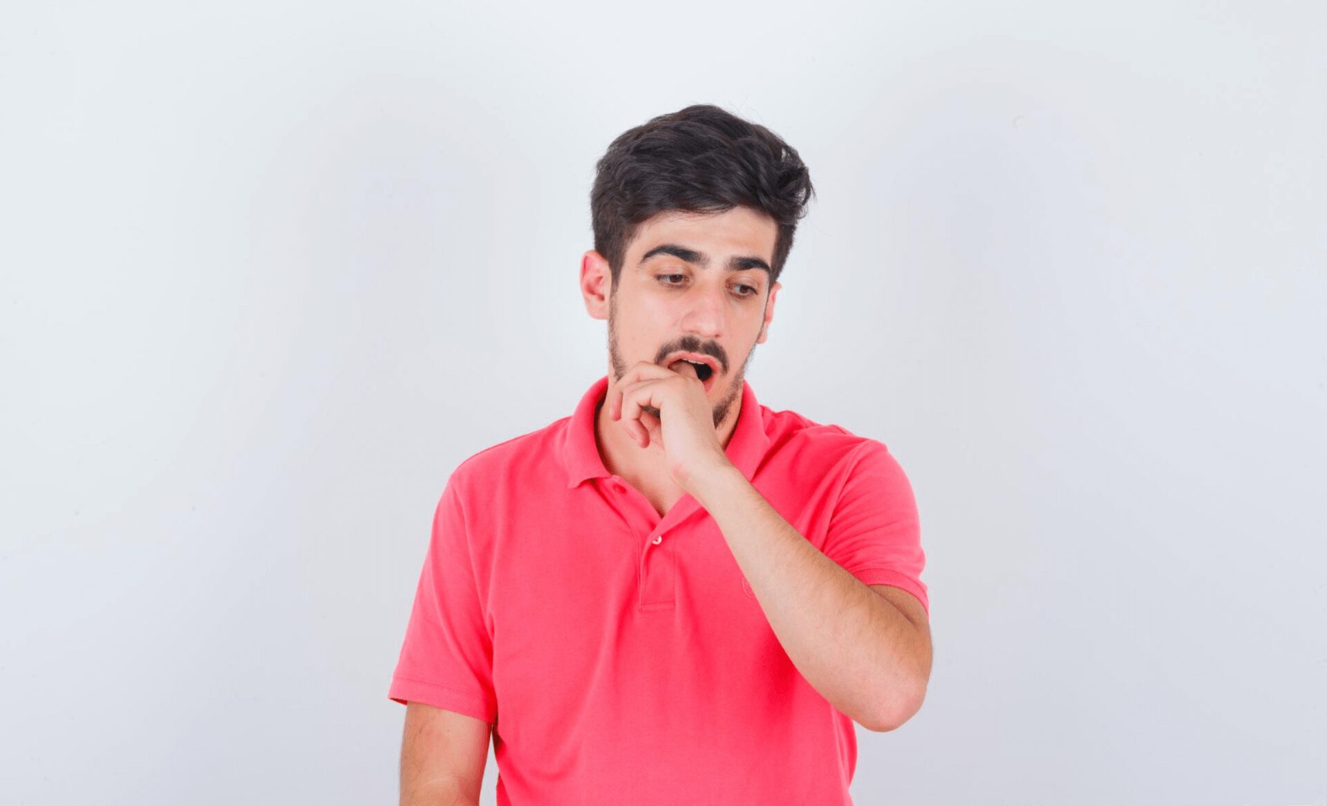 man experiencing sore inside mouth, cut on gums