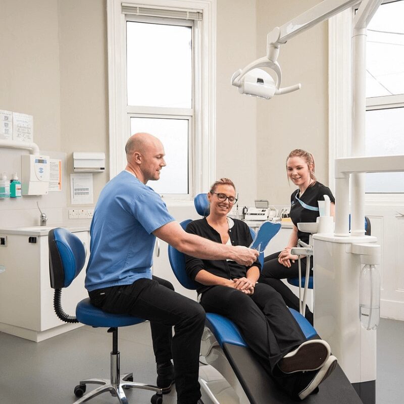 patient exploring treatment options for white spots on teeth in dental clinic