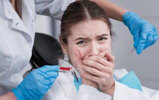close up woman terrified of dentist