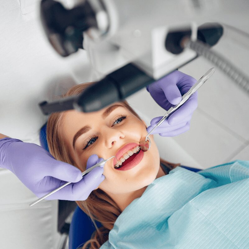 beautiful girl sitting dentists office for dental cleaning process beautiful girl sitting dentists office for dental cleaning process