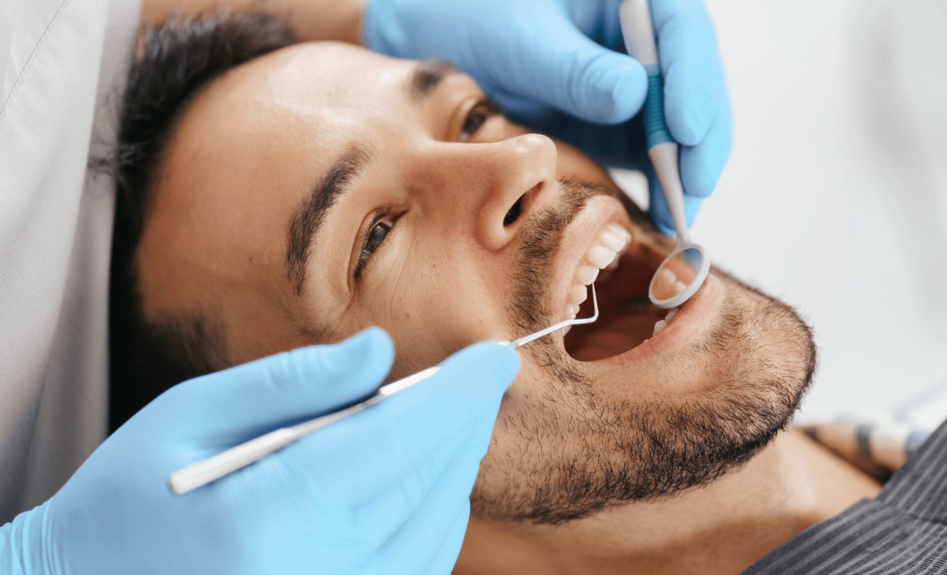 smiling young man sitting dentist having skipped dental cleaning before