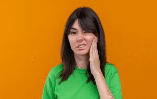 annoyed-young-caucasian-girl experiencing wisdom tooth infection symptoms