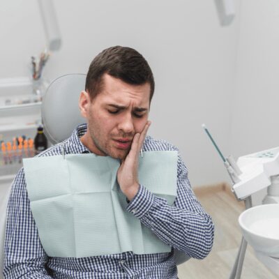 man at dentist office for wisdom tooth pain treatment relief man at dentist office for wisdom tooth pain treatment relief
