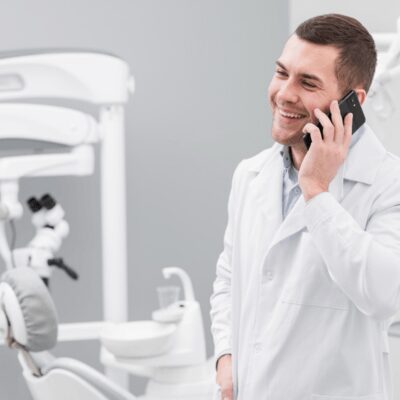 dentist attending call with patient