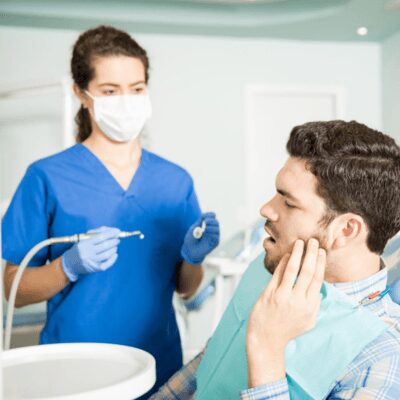 wisdom tooth patient getting treated by dentist wisdom tooth patient getting treated by dentist