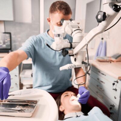 dentist performing root canal treatment procedure